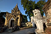 Myanmar - Inwa,  lions guarding enterance to Mahar Aung Mye Bon San Monastery 